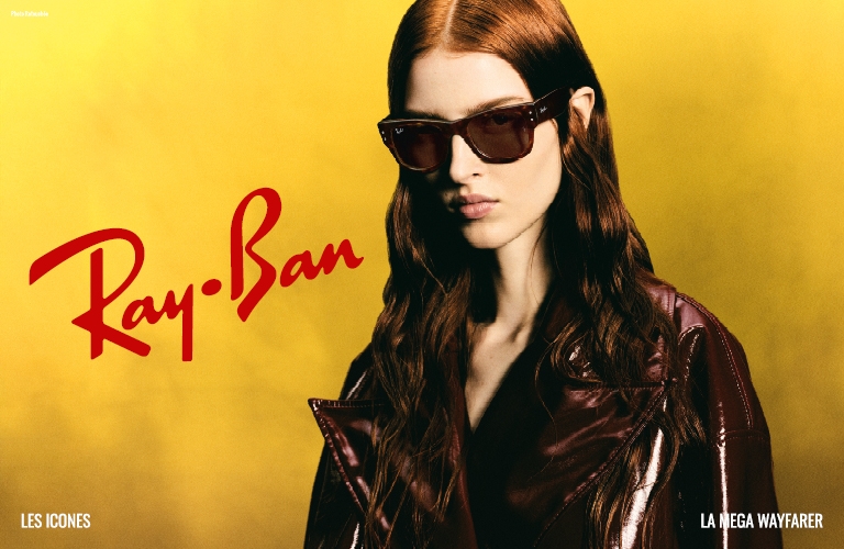 Visuel d'un homme portant des lunettes de soleil Ray-Ban de couleur doré et de forme octogonale.
